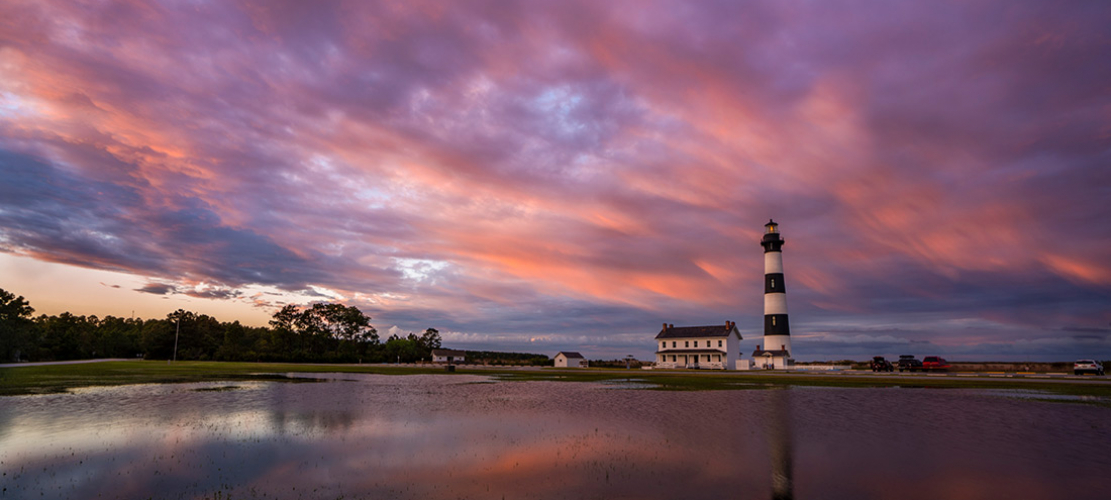 bodie-island-lighthouse-at-late-sunset-with-purple-clouds-and-reflection Bodie Island lighthouse